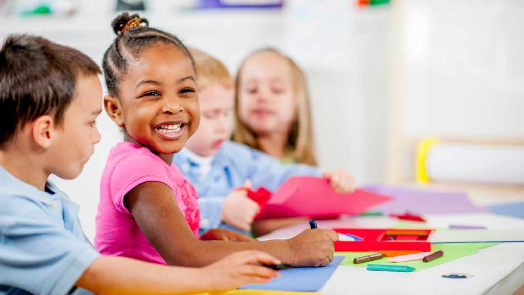 Happy young girl smiling while engaged in educational activities at childcare center