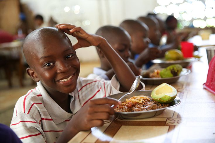 Child enjoying a nutritious meal provided by our hunger relief program