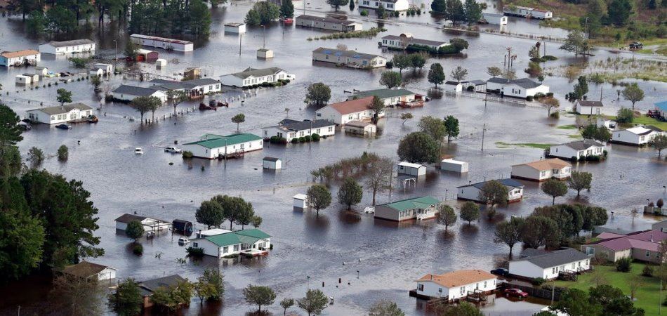 Aerial view of flooded community showing the devastating impact of natural disasters