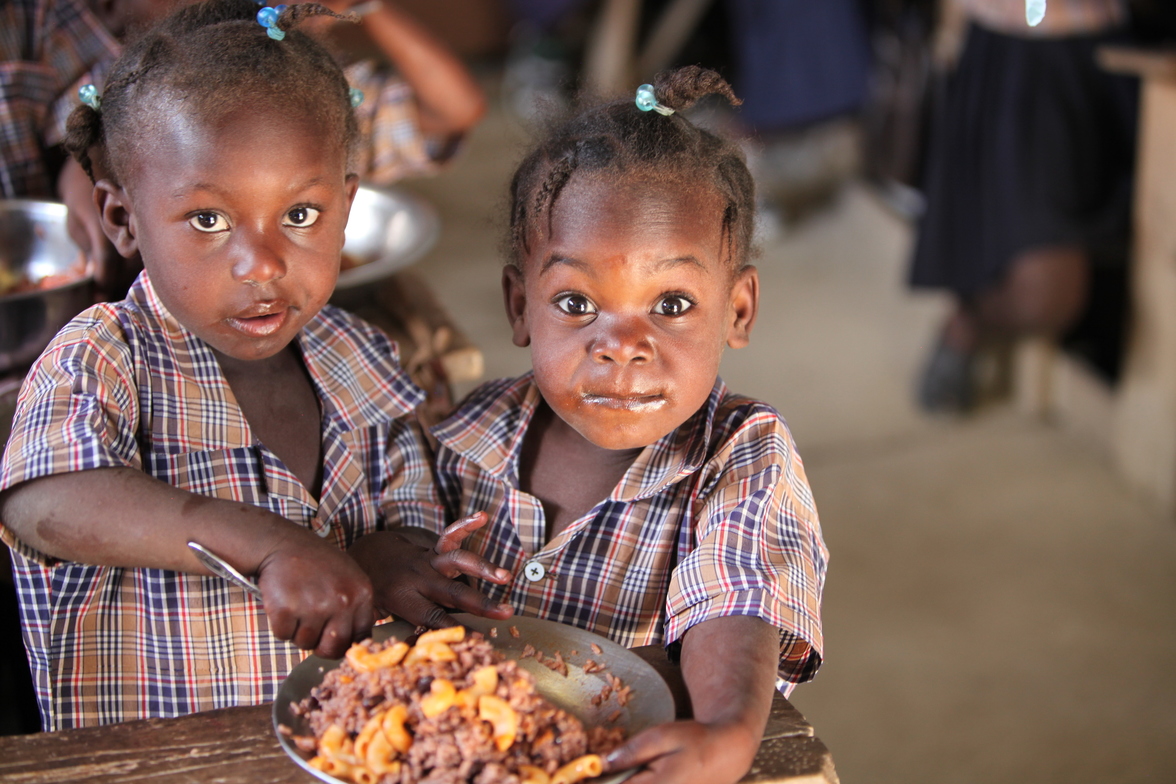 Children receiving nutritious meals through global nutrition program