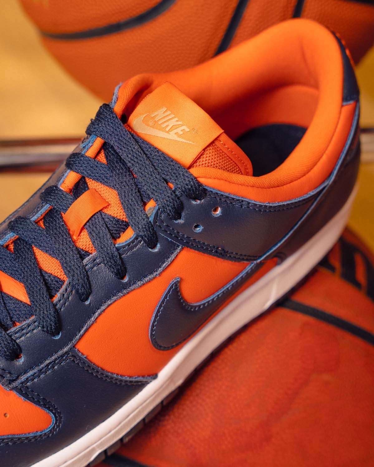 Sneakers for Change - Close-up of orange and navy Nike sneakers